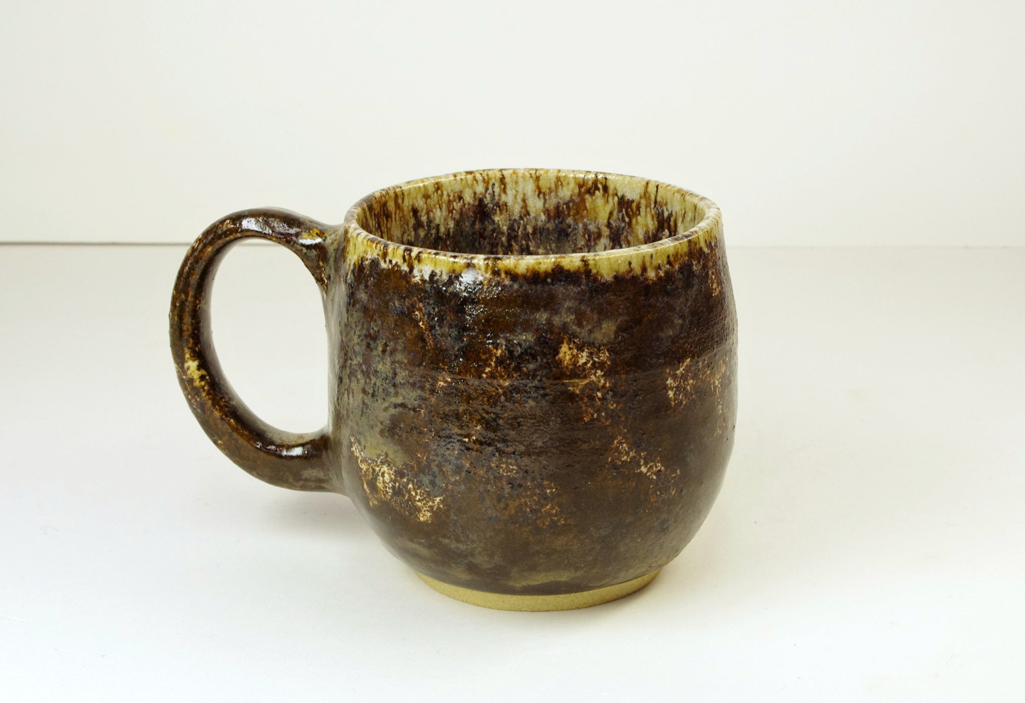 Handthrown stoneware mug browns